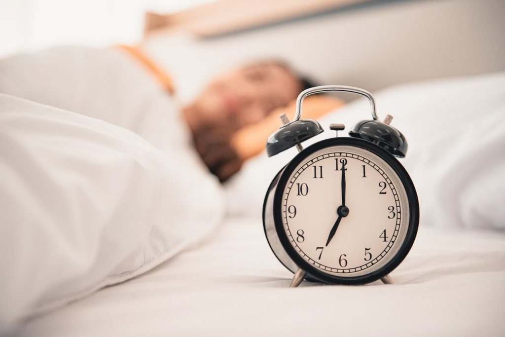 Daylight Saving Time: Everything You Need to Know Clock on bed